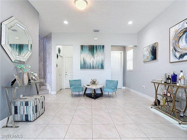 sitting room with baseboards, visible vents, recessed lighting, and light tile patterned flooring