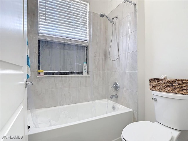 bathroom with toilet and shower / tub combination