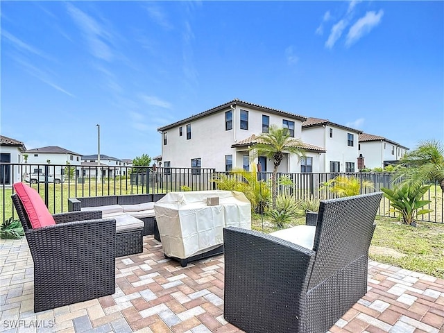 view of patio / terrace with outdoor lounge area, area for grilling, a residential view, and fence