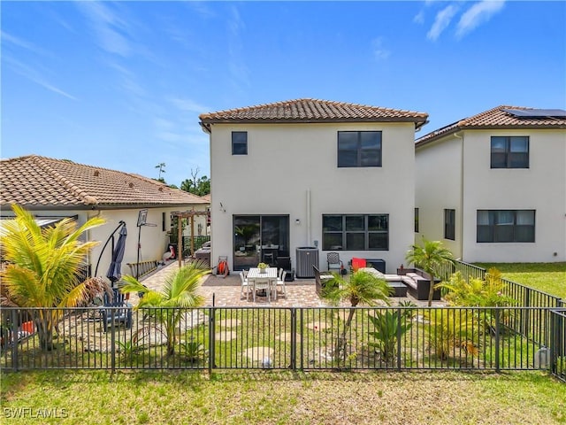 rear view of house featuring a tile roof, central AC unit, an outdoor living space, a fenced backyard, and stucco siding