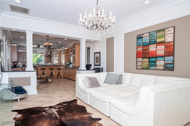 living room featuring ornate columns, visible vents, crown molding, an inviting chandelier, and light tile patterned floors