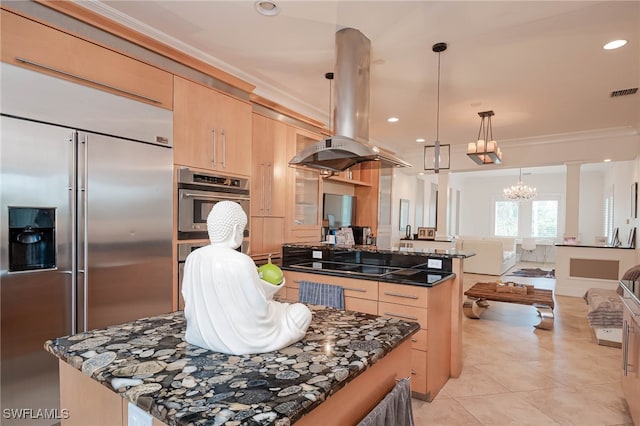 kitchen with a notable chandelier, light brown cabinetry, a center island, island range hood, and stainless steel appliances