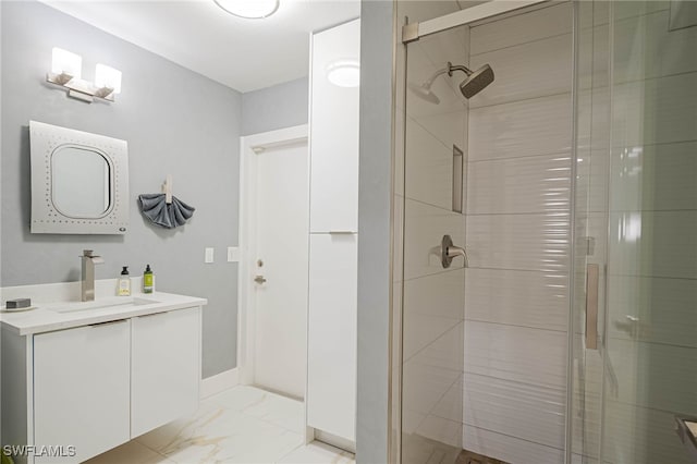 bathroom featuring vanity, marble finish floor, and a shower stall
