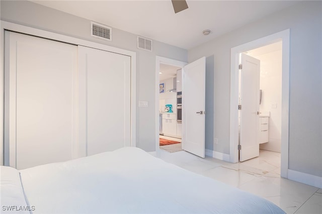bedroom featuring baseboards, marble finish floor, a closet, and visible vents