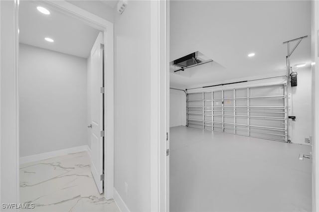 2932 18th St SW, Lehigh Acres, FL 33976 - garage with recessed lighting and baseboards