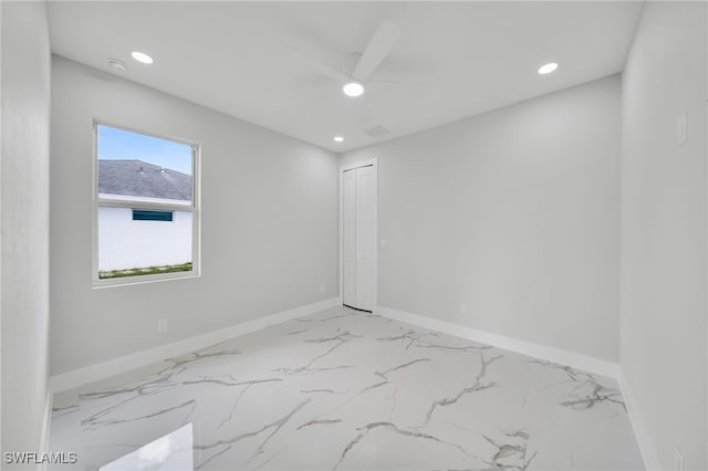 2932 18th St SW, Lehigh Acres, FL 33976 - unfurnished room with recessed lighting, light marble finish flooring, baseboards, and a ceiling fan