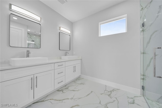 2932 18th St SW, Lehigh Acres, FL 33976 - bathroom featuring a marble finish shower, double vanity, baseboards, and marble look tiles