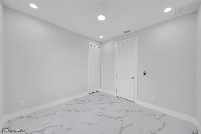 2932 18th St SW, Lehigh Acres, FL 33976 - unfurnished room featuring recessed lighting, marble finish flooring, and baseboards