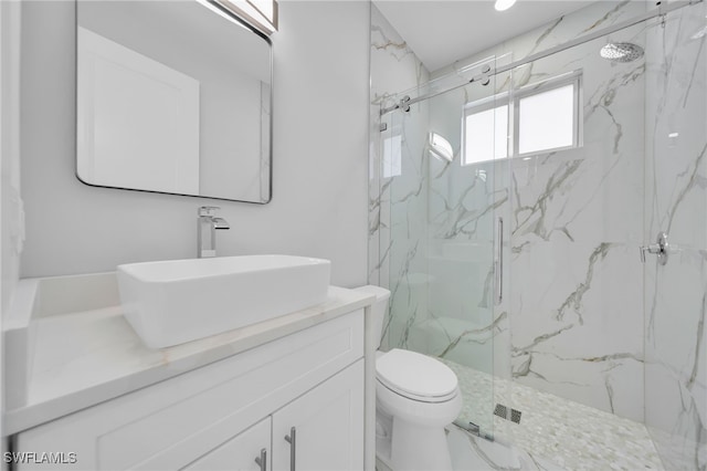 2932 18th St SW, Lehigh Acres, FL 33976 - bathroom with vanity, toilet, and a marble finish shower