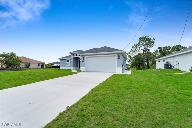 2932 18th St SW, Lehigh Acres, FL 33976 - view of front of home featuring stucco siding, concrete driveway, an attached garage, a front yard, and central AC