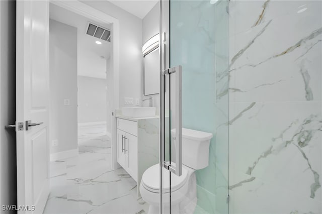 2932 18th St SW, Lehigh Acres, FL 33976 - bathroom with toilet, vanity, marble look tile flooring, and baseboards