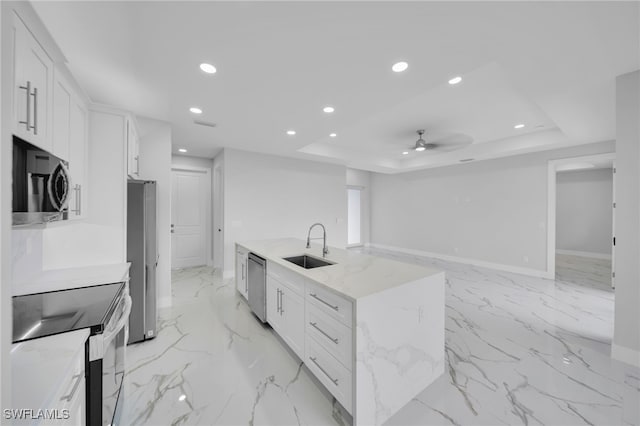 2932 18th St SW, Lehigh Acres, FL 33976 - kitchen with appliances with stainless steel finishes, a sink, recessed lighting, white cabinetry, and a ceiling fan