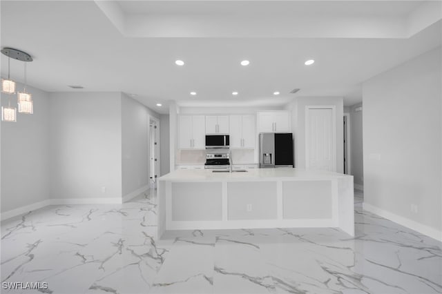 2932 18th St SW, Lehigh Acres, FL 33976 - kitchen with stainless steel appliances, recessed lighting, baseboards, white cabinets, and light countertops