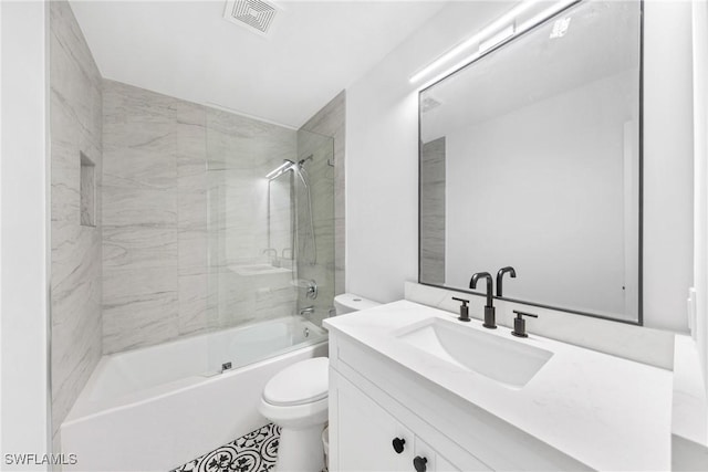 full bath featuring shower / bath combination with glass door, visible vents, toilet, and vanity