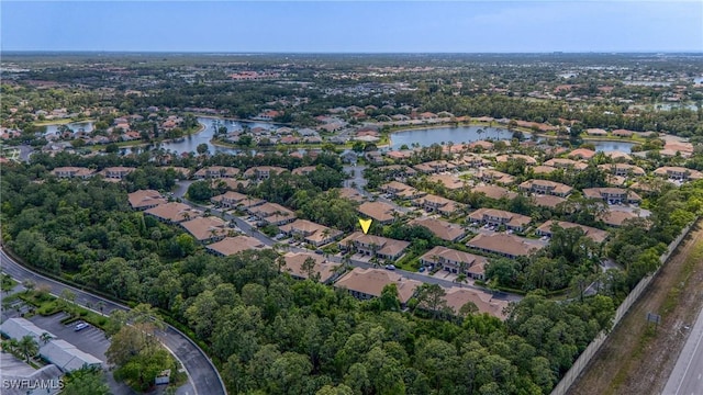 aerial view featuring a water view and a residential view