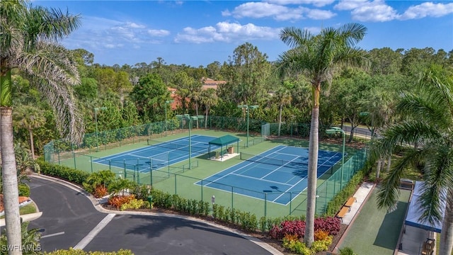 view of tennis court with fence