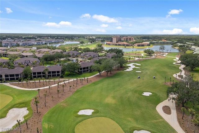 bird's eye view featuring view of golf course, a water view, and a residential view