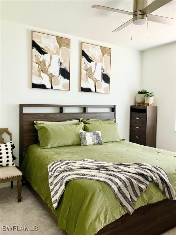5690 Agostino Way, Ave Maria, FL 34142 - bedroom featuring carpet and a ceiling fan