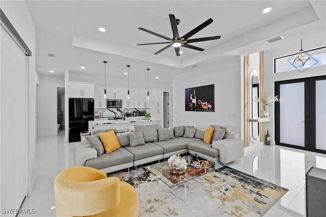 1007 NW 19th St, Cape Coral, FL 33993 - living area with a tray ceiling, visible vents, a ceiling fan, and recessed lighting