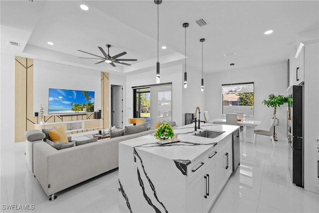 1007 NW 19th St, Cape Coral, FL 33993 - kitchen featuring a sink, dishwasher, decorative light fixtures, visible vents, and freestanding refrigerator