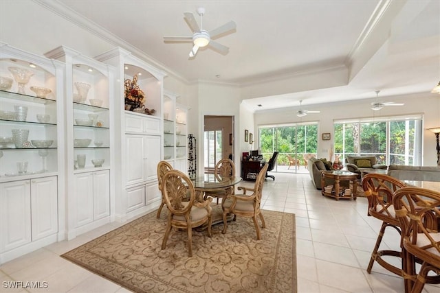 dining space featuring ornamental molding, ceiling fan, built in features, and light tile patterned flooring