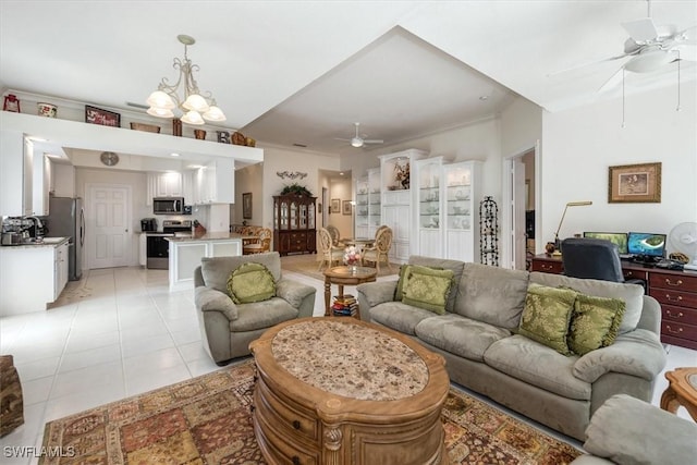 living area featuring light tile patterned floors and ceiling fan with notable chandelier