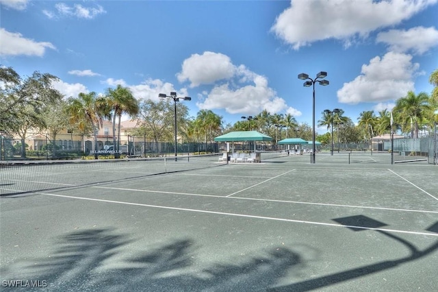 view of sport court featuring fence