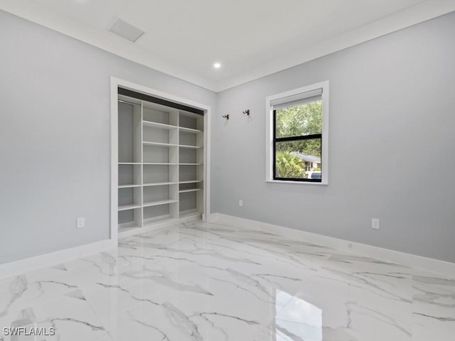 2538 4th Ave NE, Naples, FL 34120 - unfurnished room with marble finish floor and baseboards