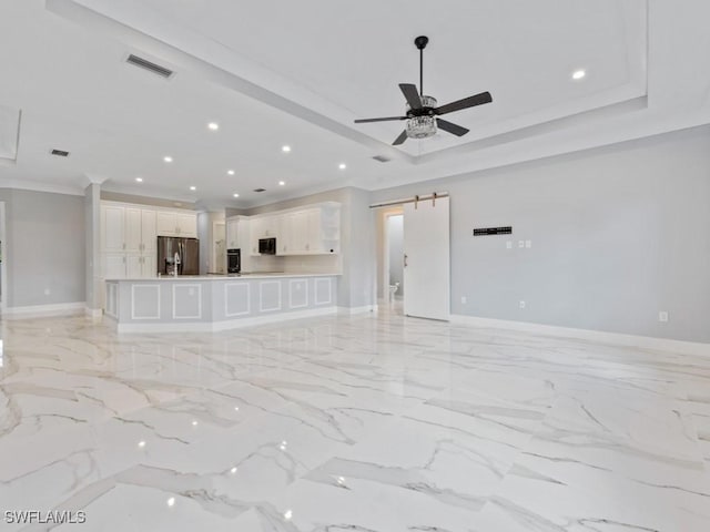 2538 4th Ave NE, Naples, FL 34120 - unfurnished living room with a barn door, baseboards, recessed lighting, ornamental molding, and a ceiling fan