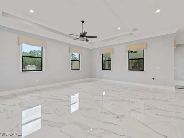 2538 4th Ave NE, Naples, FL 34120 - unfurnished room with a raised ceiling, baseboards, recessed lighting, a ceiling fan, and marble finish floor
