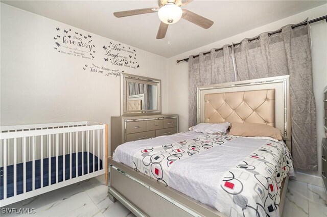 4516 Santa Barbara Blvd Unit 1, Cape Coral, FL 33914 - bedroom with a ceiling fan and marble finish floor