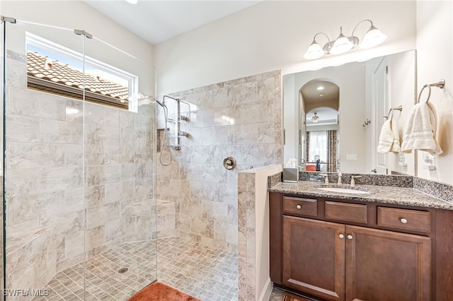 full bath featuring vanity and a walk in shower