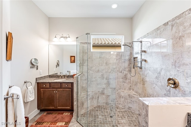 bathroom featuring a shower stall and vanity