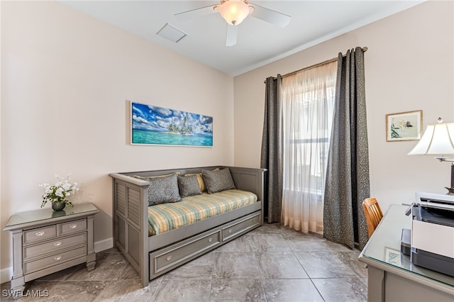 sitting room with visible vents and ceiling fan