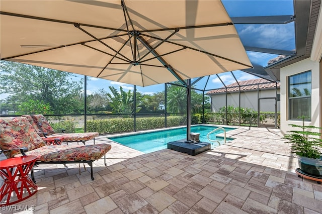 outdoor pool featuring a lanai and a patio area