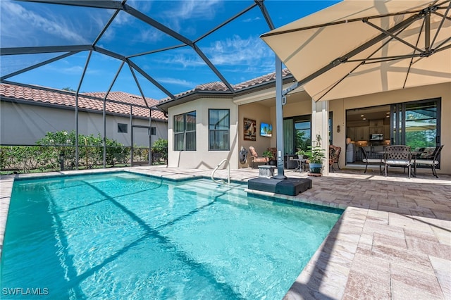 pool with a lanai and a patio