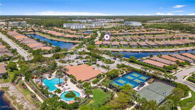 bird's eye view featuring a water view and a residential view