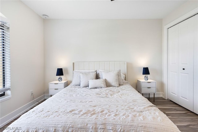 12181 Kelly Sands Way Unit 1538, Fort Myers, FL 33908 - bedroom featuring a closet, wood finished floors, and baseboards
