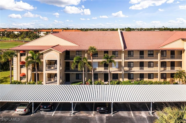 12181 Kelly Sands Way Unit 1538, Fort Myers, FL 33908 - view of property featuring covered and uncovered parking