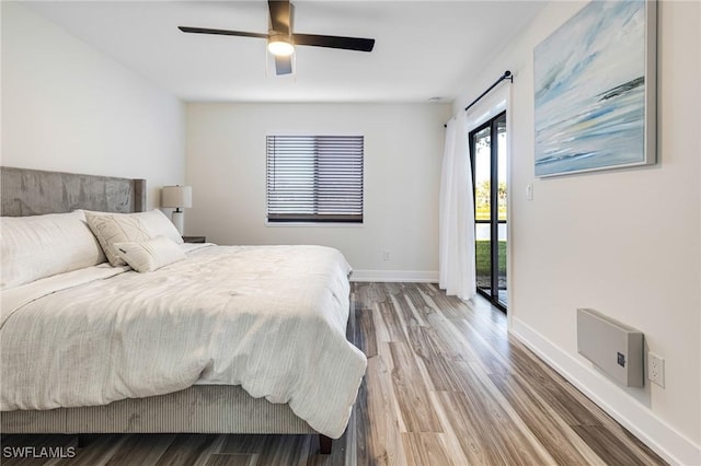 12181 Kelly Sands Way Unit 1538, Fort Myers, FL 33908 - bedroom with access to outside, wood finished floors, baseboards, and ceiling fan