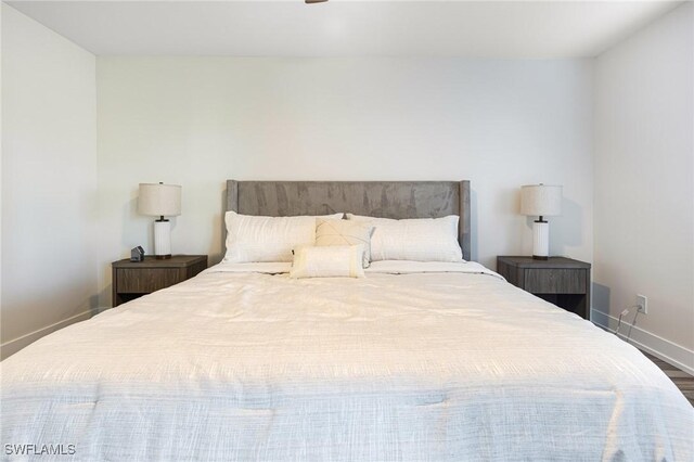 12181 Kelly Sands Way Unit 1538, Fort Myers, FL 33908 - bedroom with baseboards and wood finished floors