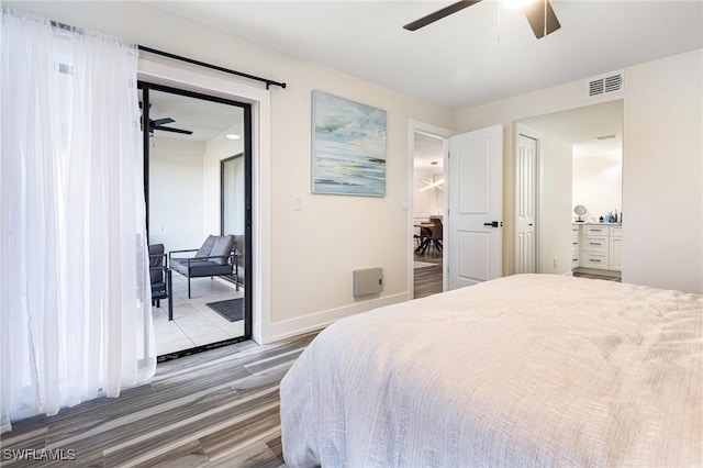 12181 Kelly Sands Way Unit 1538, Fort Myers, FL 33908 - bedroom with baseboards, ceiling fan, visible vents, wood finished floors, and access to exterior