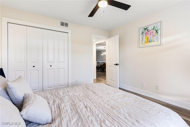 12181 Kelly Sands Way Unit 1538, Fort Myers, FL 33908 - bedroom with a closet, visible vents, wood finished floors, and baseboards