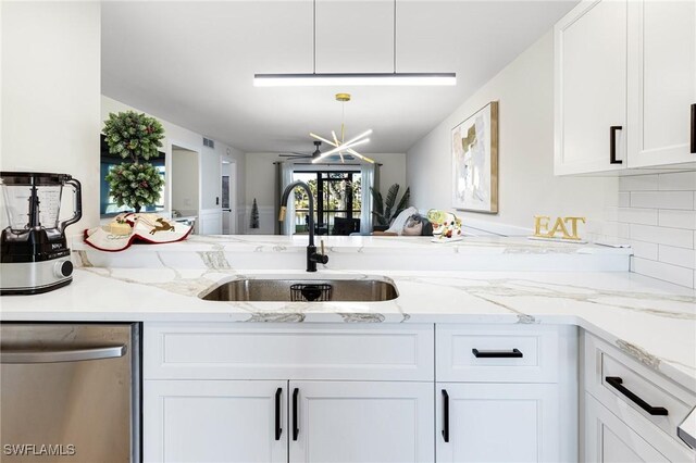 12181 Kelly Sands Way Unit 1538, Fort Myers, FL 33908 - kitchen featuring a sink, light stone countertops, white cabinets, and dishwasher