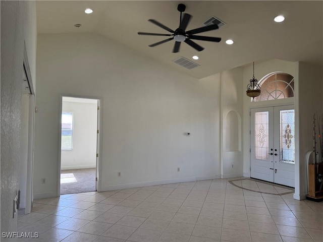 4328 NW 27th Ter, Cape Coral, FL 33993 - entrance foyer with high vaulted ceiling, a ceiling fan, arched walkways, light tile patterned flooring, and baseboards