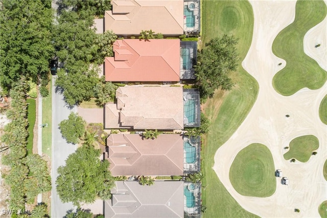 birds eye view of property with golf course view