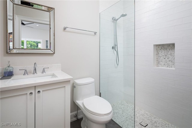 full bath featuring walk in shower, toilet, ceiling fan, and vanity