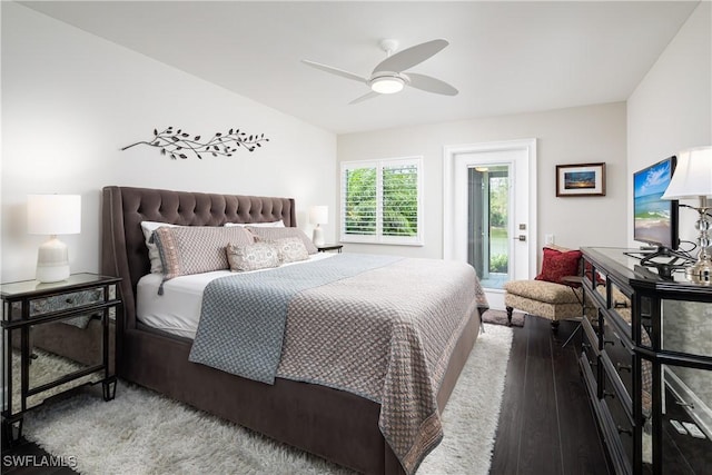 bedroom featuring access to exterior, a ceiling fan, and wood finished floors