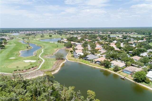 birds eye view of property featuring golf course view, a water view, and a residential view