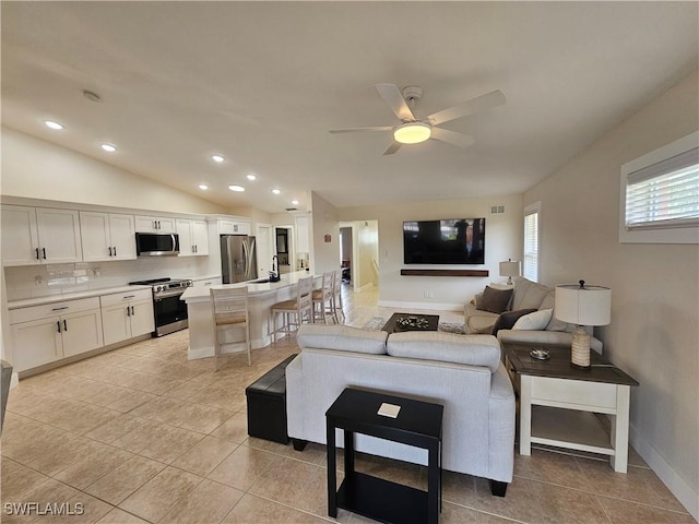 19942 Lake Vista Cir N Unit 2, Lehigh Acres, FL 33936 - living area with recessed lighting, lofted ceiling, a ceiling fan, and light tile patterned floors
